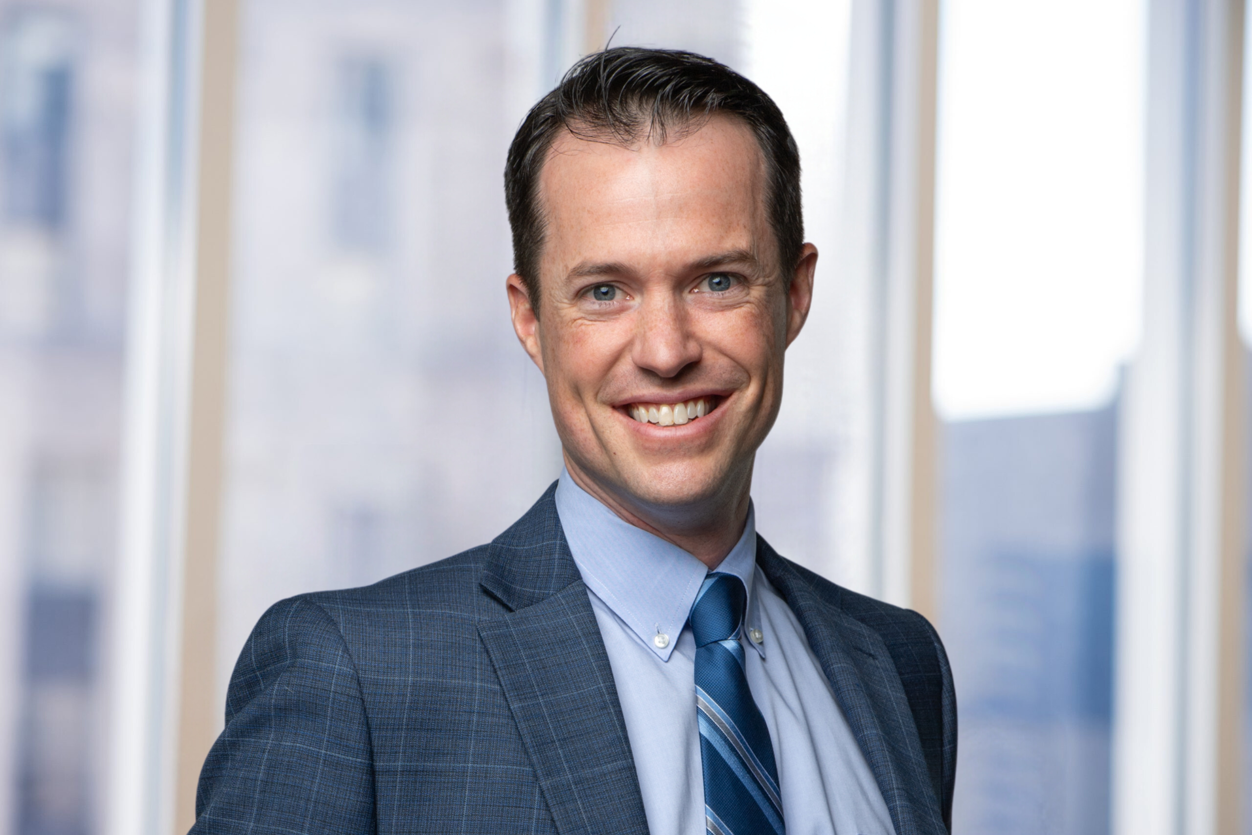 Sean dudley in front of the Chapman Spingola Window